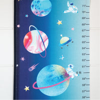 Children's growth chart with space-themed design featuring planets and astronauts.