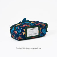 Colorful pencil case with animal pattern and Zookeeper branding on a white background