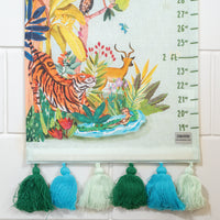 Children's growth chart with jungle-themed illustration and colorful tassels