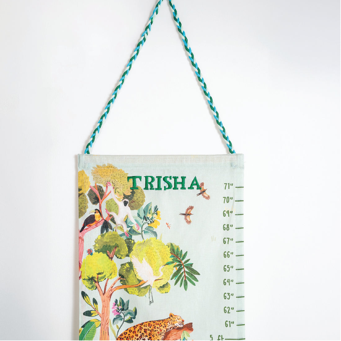 Children's growth chart with jungle design and name 'Trisha' .