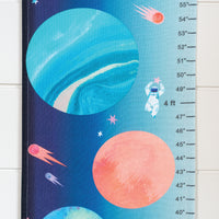 Growth chart with space-themed design featuring planets and an astronaut.