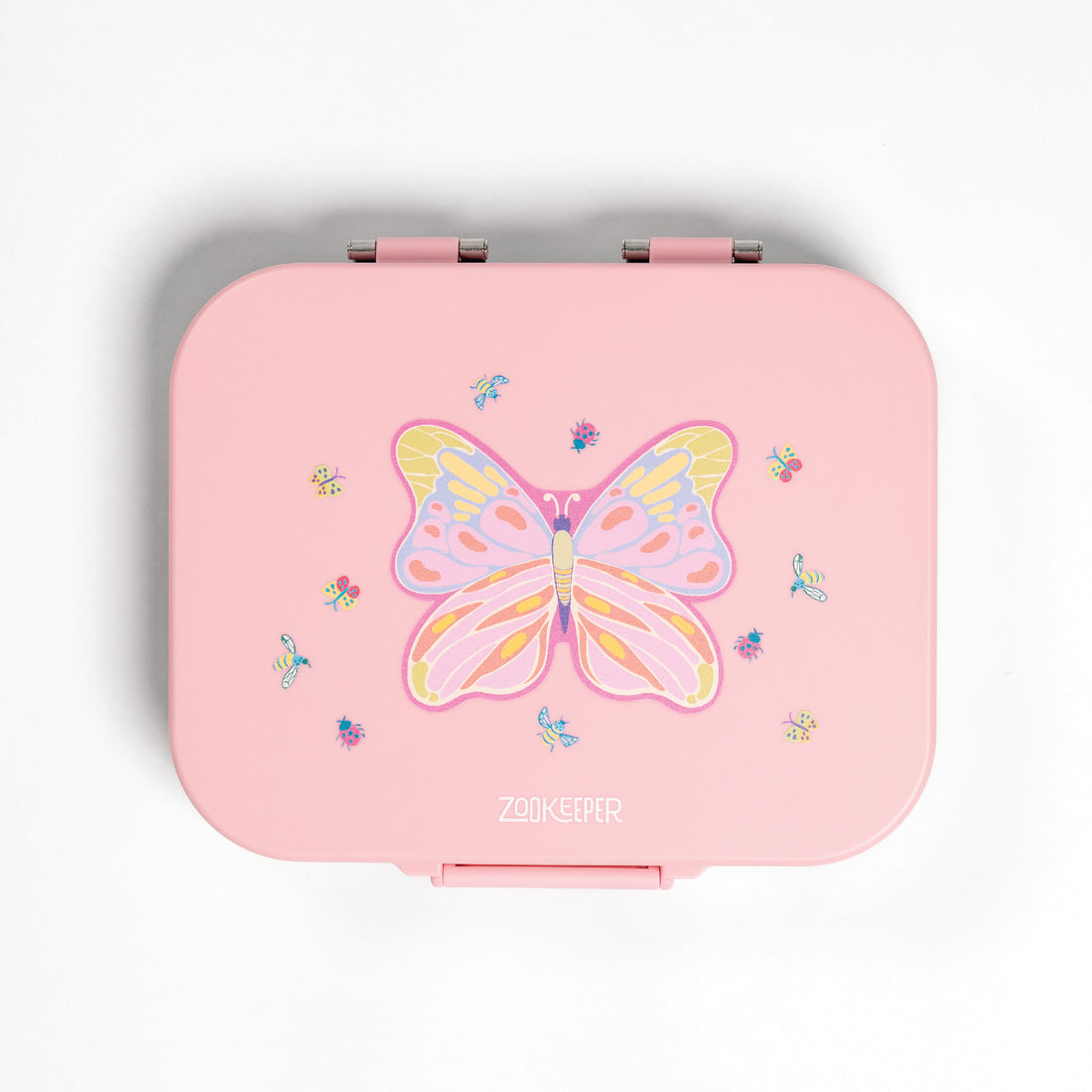 Pink lunch box with butterfly design on a white background